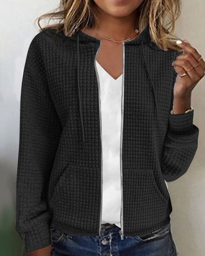 Cozy women's sleeveless jacket, ideal for comfort wear, boasting practical pockets and an adjustable drawstring waist.
