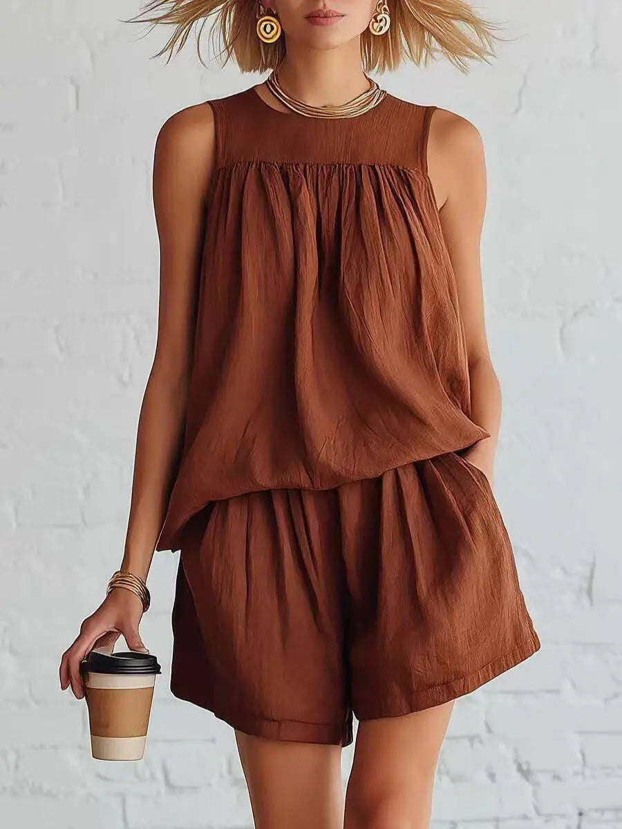 Effortlessly chic women's two-piece summer outfit with a gathered top and high-waist casual shorts.