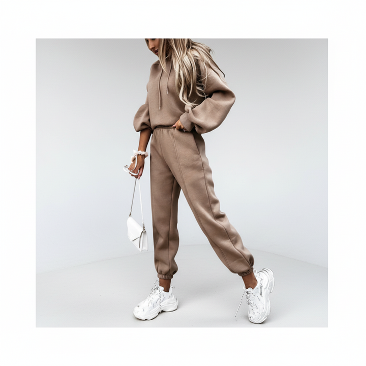 Full shot of a model in a cozy women's hoodie and jogger set, perfect for casual wear or athleisure