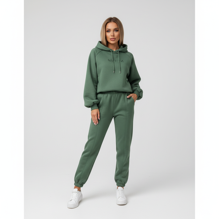 Women's comfortable two-piece jogger set in a neutral color, ideal for home or casual outings, winter fashion