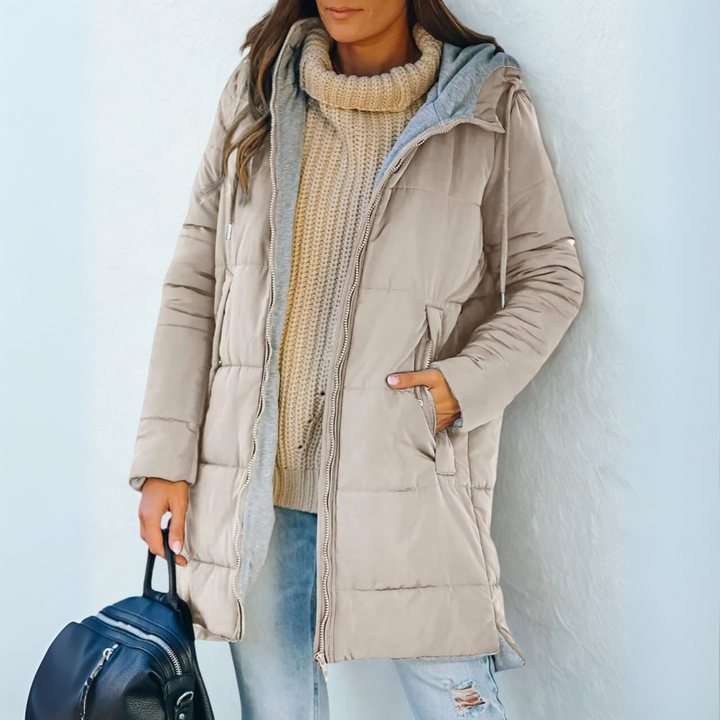 Modern women's puffer jacket with hood, offering warmth & style for casual winter & fall fashion.