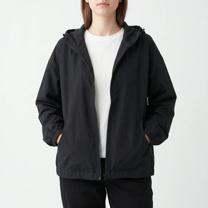 Lightweight women's hooded windbreaker, ideal for activewear & outdoor activities. Casual spring/fall zipper jacket.