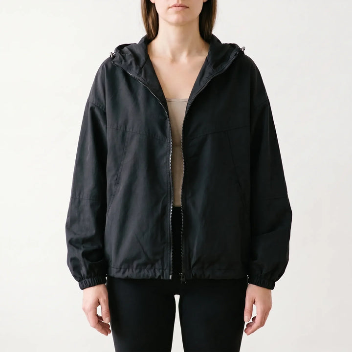 Women's hooded windbreaker jacket for everyday wear. Lightweight, casual outerwear for transitional spring & fall.