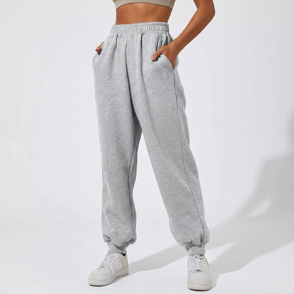 Lifestyle shot of a woman walking in Martha jogger pants, showcasing freedom of movement, activewear