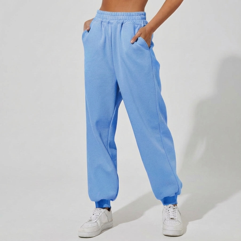 Side profile of Martha women's jogger pants, gray, demonstrating the relaxed fit and pocket design