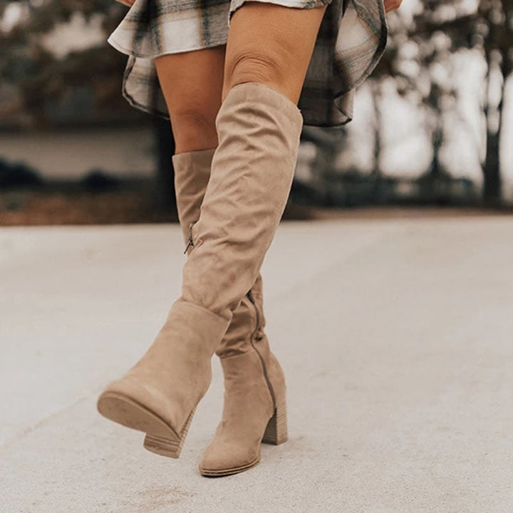 Women's casual knee-high zip boots. Stylish & comfortable everyday footwear for fall and winter seasons.