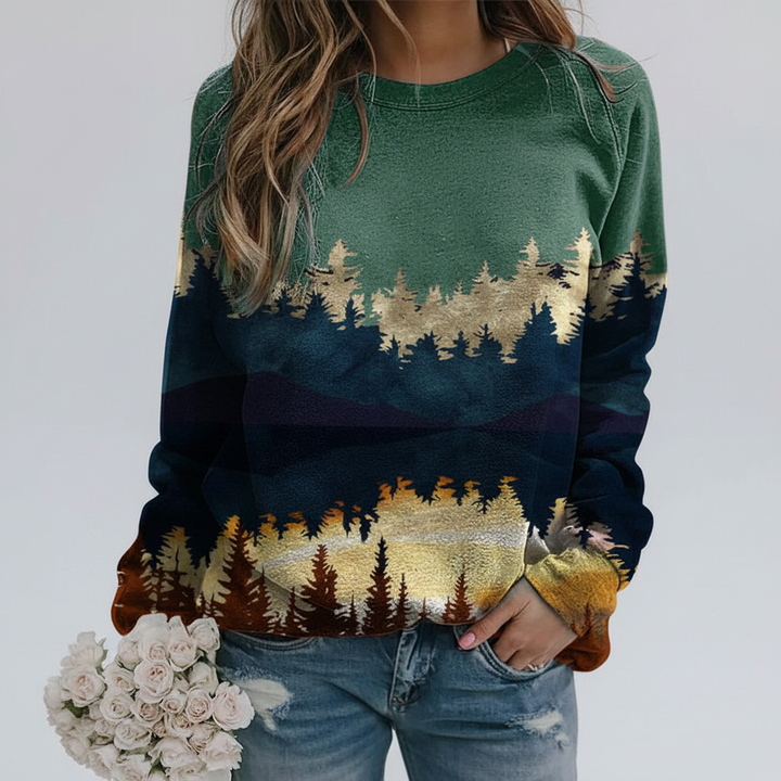 Women's round neck pullover featuring a vibrant landscape print, trendy and warm
