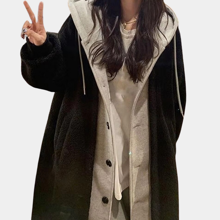 Comfortable women's long hooded jacket, a stylish and warm everyday outerwear choice.