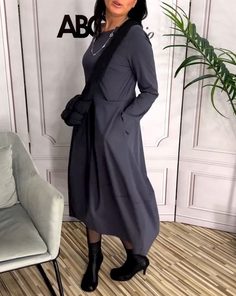 Comfortable solid color women's maxi dress. Features a round neck, long sleeves & flowy A-line silhouette.
