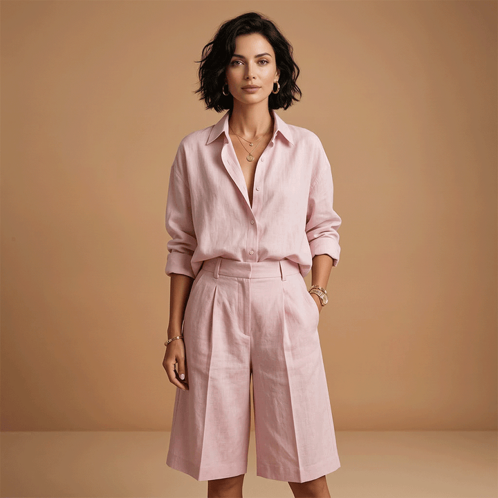 Relaxed fit women's two-piece set with long sleeve shirt & comfortable shorts, ideal daywear.