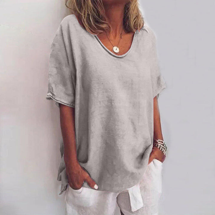Stylish women's oversized summer top with a loose fit. Casual short sleeve t-shirt, perfect for warm weather comfort.