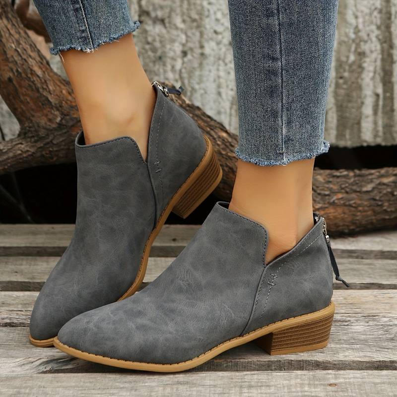 Comfortable women's slip-on ankle boots with a low block heel, perfect for versatile everyday fall fashion.