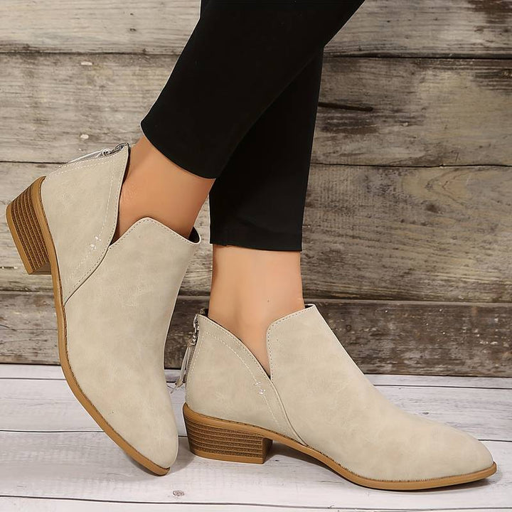 Chic women's low heel slip-on boots, ideal for easy, comfortable casual wear during fall and winter seasons.