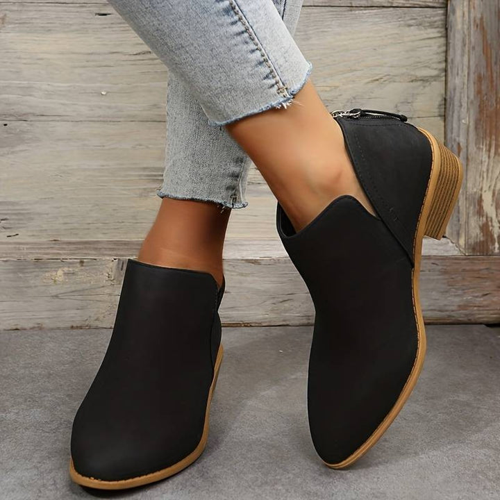 Versatile women's casual ankle boots, featuring a comfortable slip-on design & low block heel for everyday style.