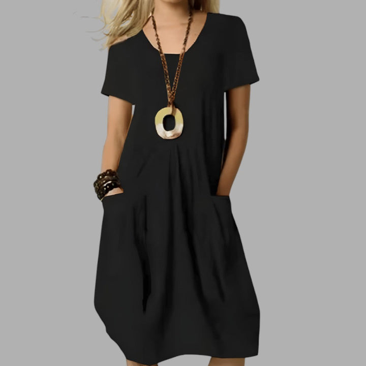 Stylish women's midi dress, perfect for a flattering casual look. Essential everyday fashion for summer.