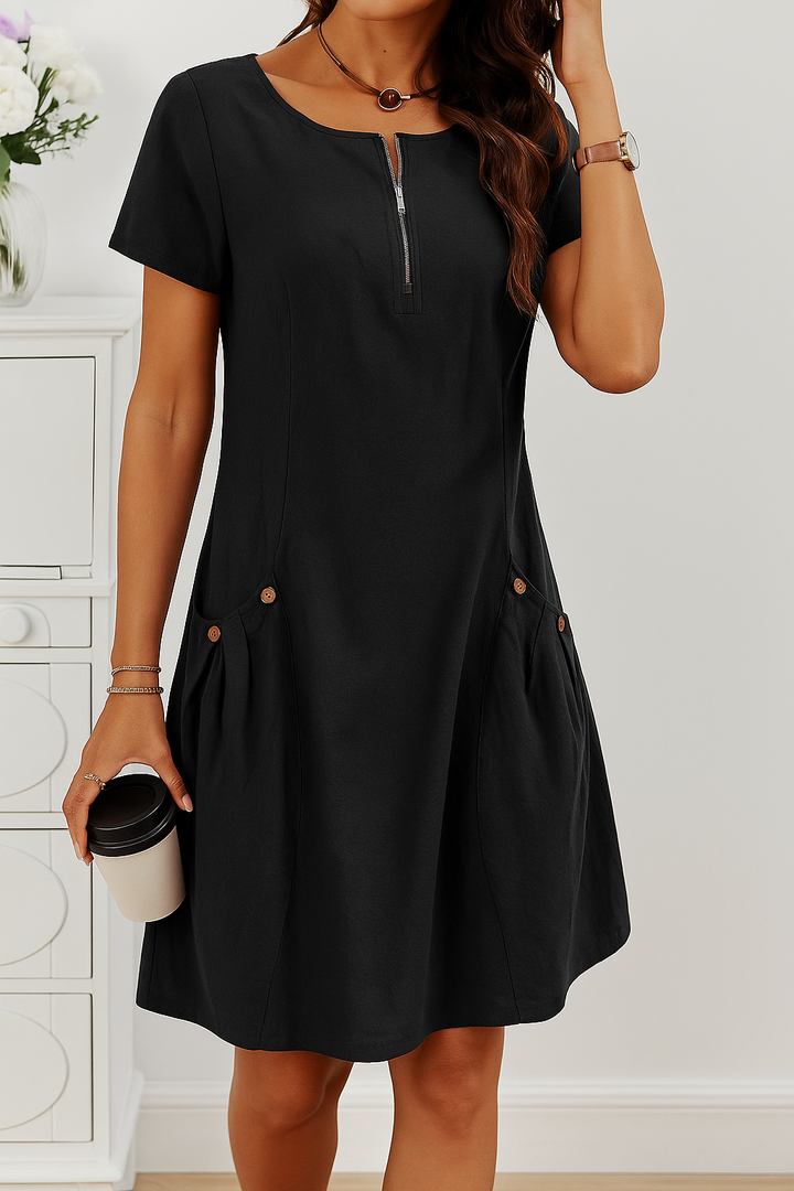 Chic women's casual midi dress, short sleeve design. Zip front and button pockets add style & convenience.
