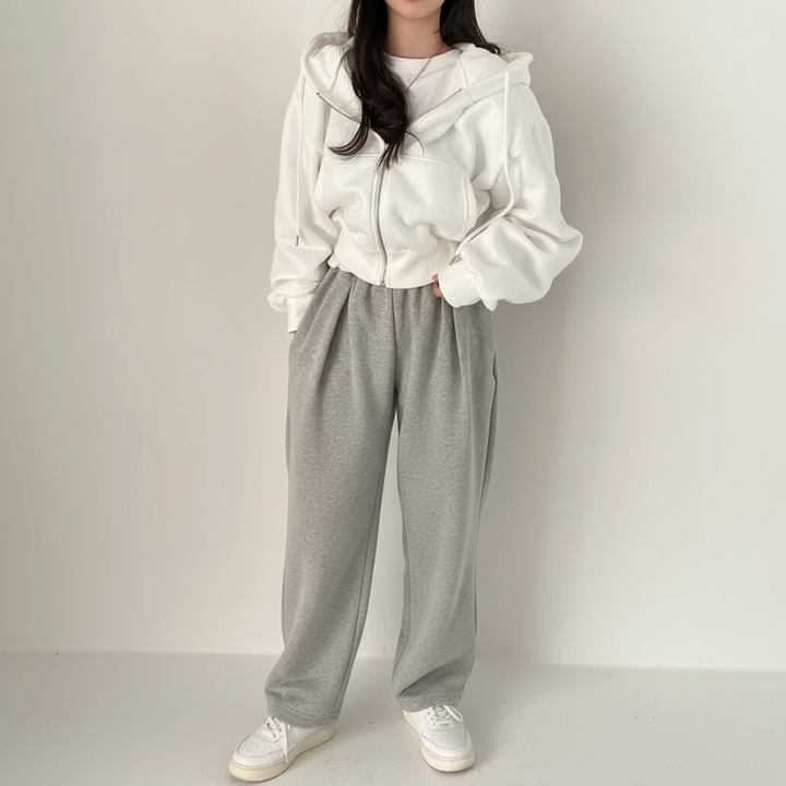 Detailed image of the hood and front pockets on a women's casual oversized vest
