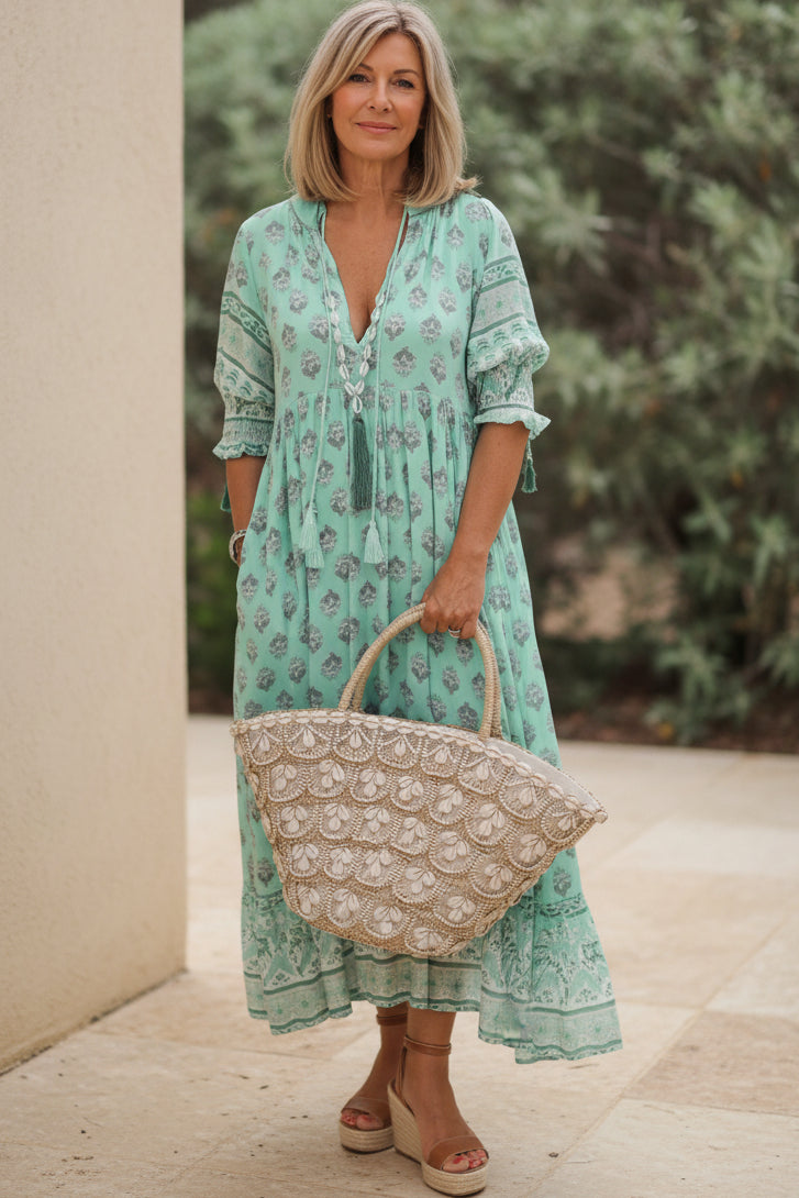 Comfortable women's casual printed dress with a V-neck and half-sleeves, great for everyday versatile wear.