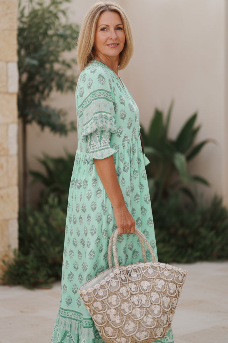 Stylish women's printed half-sleeve V-neck dress, a must-have for chic summer fashion and spring style.