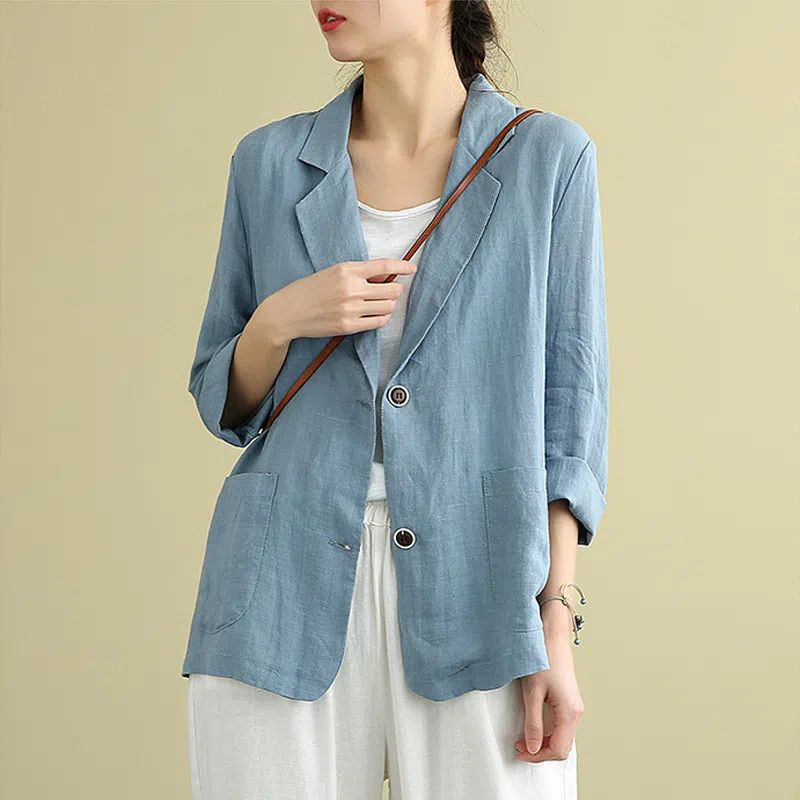 Women's casual relaxed fit single-breasted blazer in a light color, perfect for smart casual or workwear.