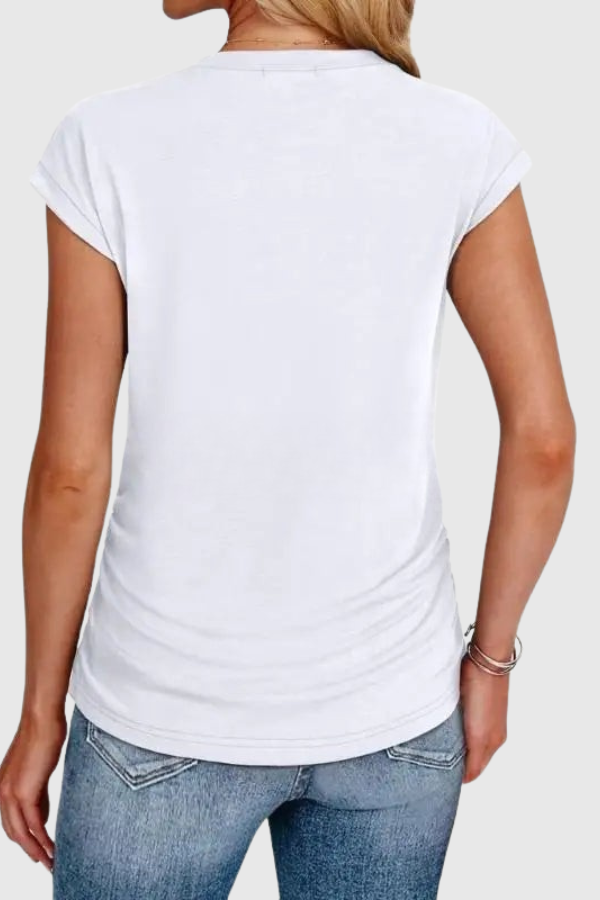 Women's comfortable everyday wear tunic top with trendy ruched sides and ruffle short sleeves.