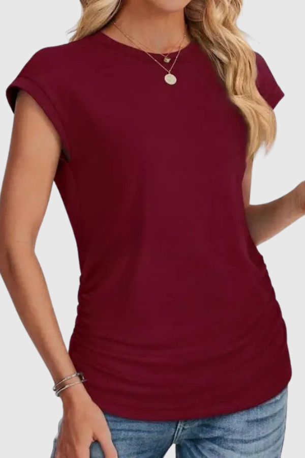 Stylish women's relaxed fit tunic top, featuring chic ruched sides and comfortable short sleeves.