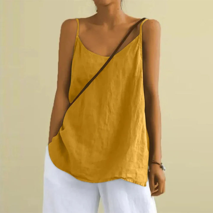 Stylish women's sleeveless cami blouse. Light, flowy summer tank top for vacation or beach day.