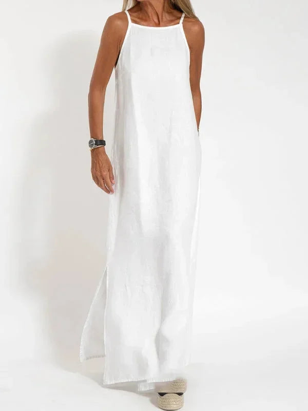 Effortless women's sleeveless maxi dress with side slit, ideal for beach or casual outings.