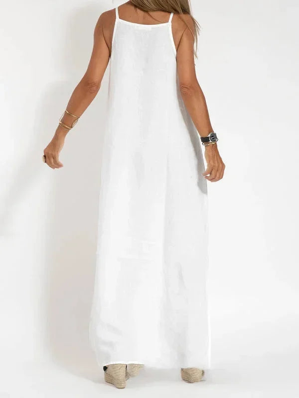 Long, elegant women's sleeveless maxi dress featuring a modern side slit, casual chic.