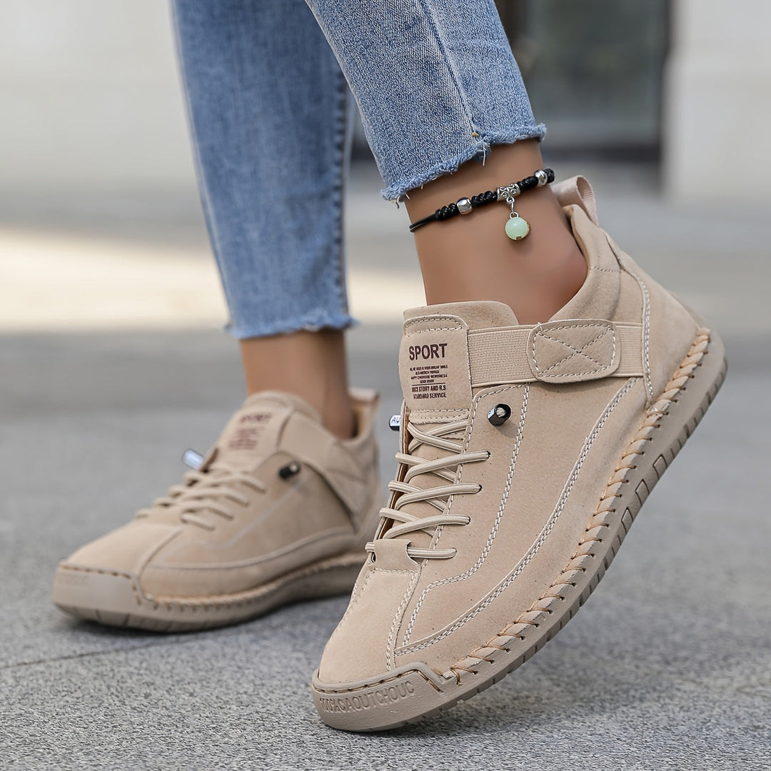 Women's casual stitched lace-up sneakers, comfortable for everyday wear and walking. Low-top design.