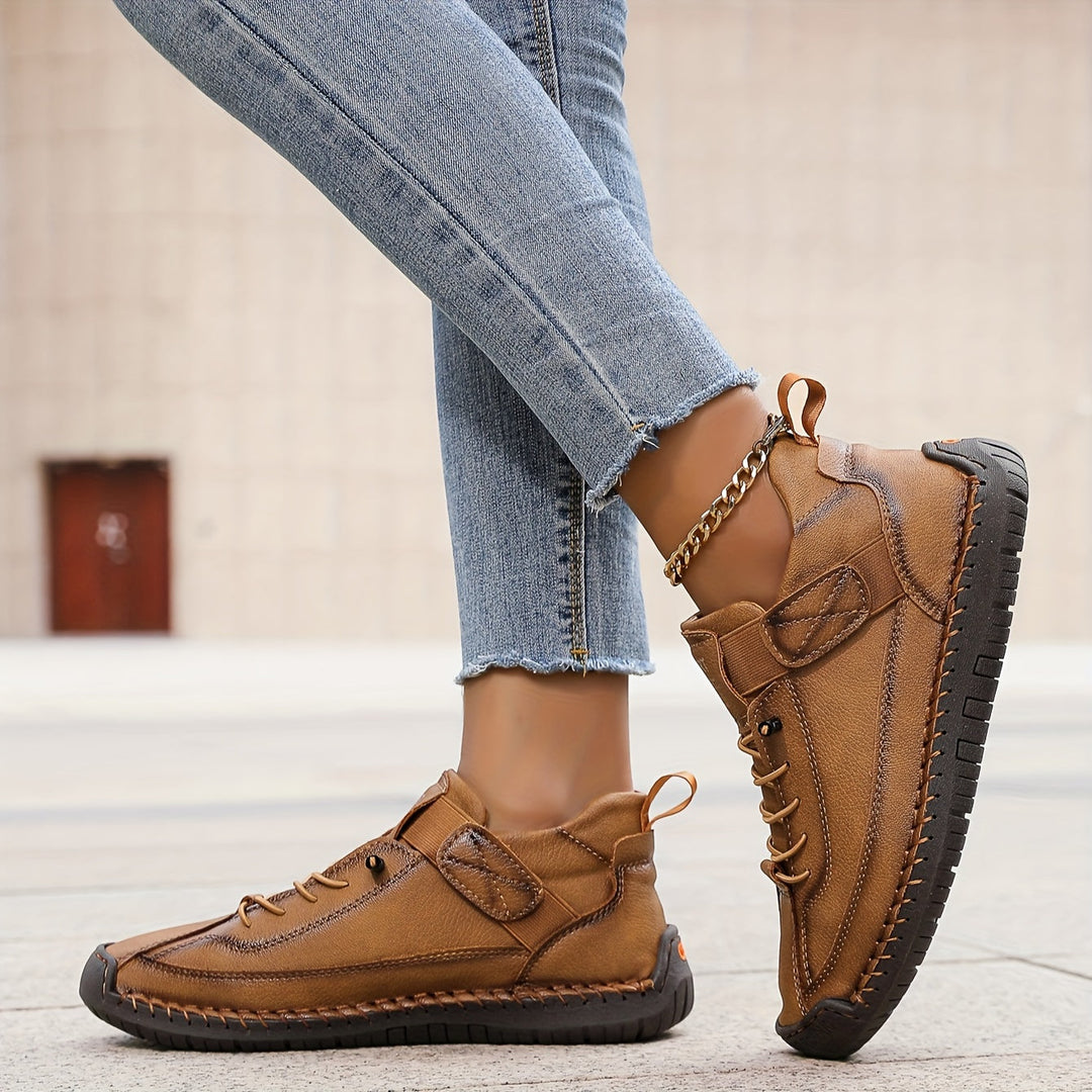 Stylish & practical women's lace-up walking shoes, featuring unique stitched patterns for comfortable everyday use.