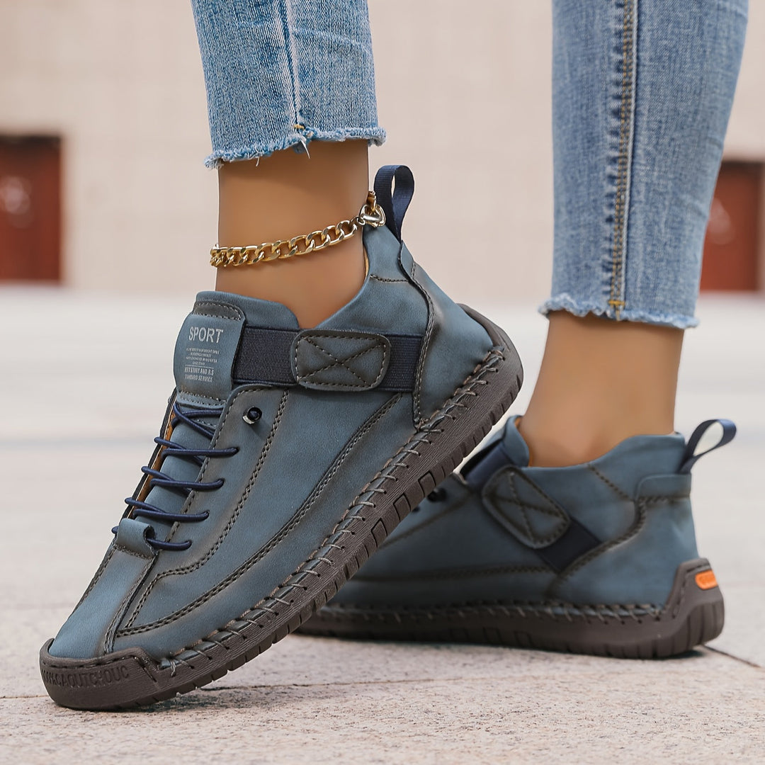 Versatile women's casual sneakers, featuring secure lace-up closure and stylish stitched details for daily comfort.