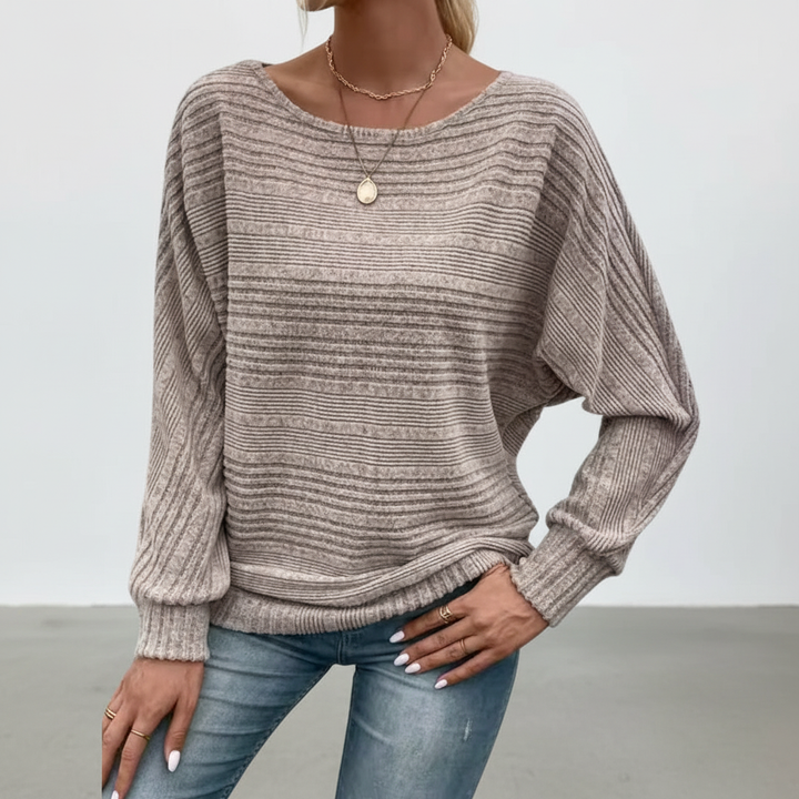 Comfortable women's striped knitwear with long sleeves, ideal for autumn and winter