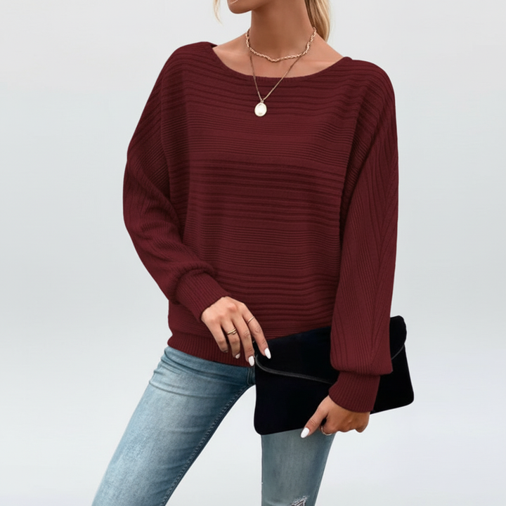 Close-up of the striped pattern on a women's casual knit sweater, soft texture