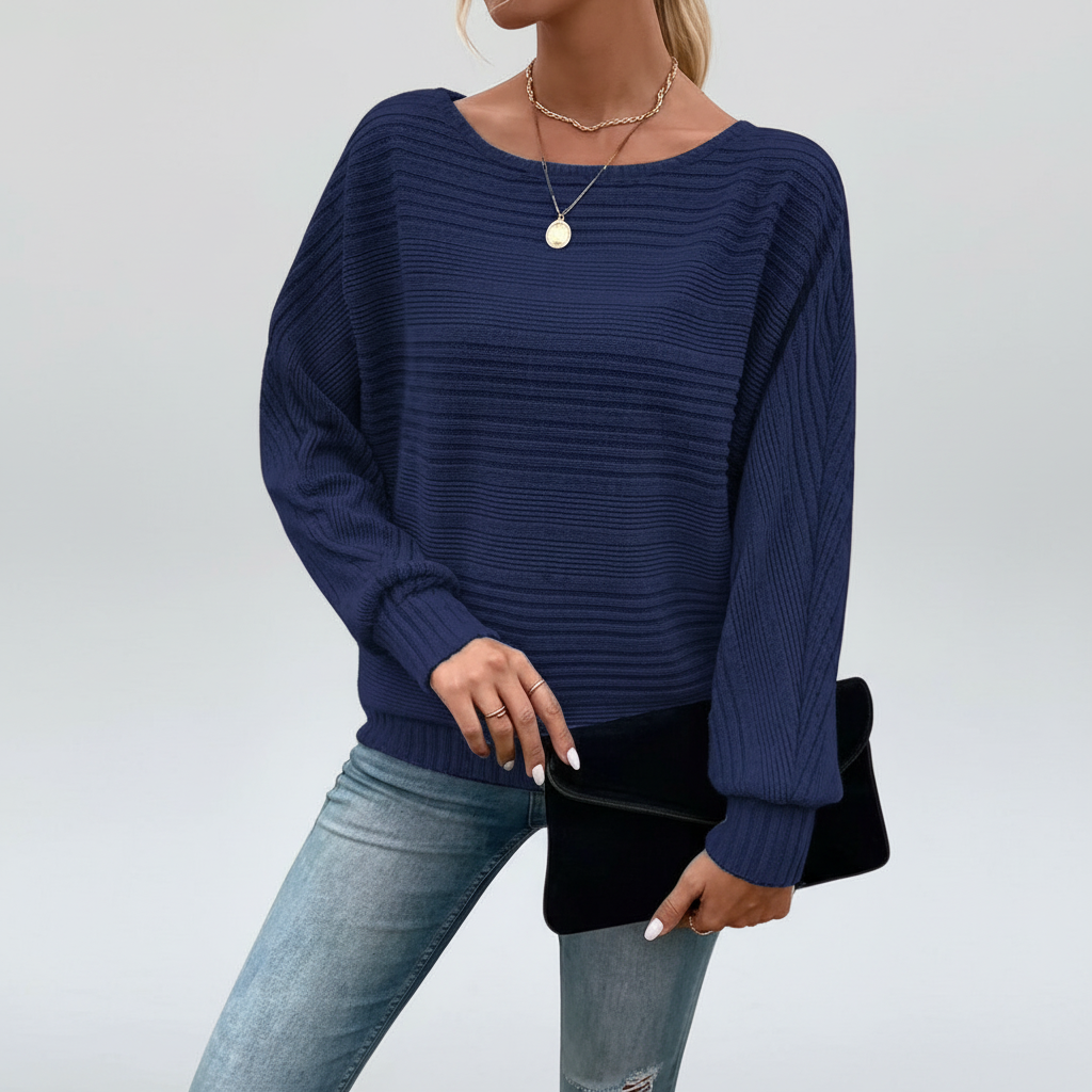 Model wearing a women's striped knit sweater, showcasing comfort and casual style