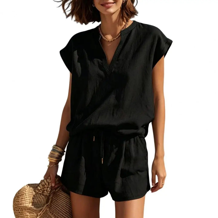Stylish women's two-piece summer outfit featuring a V-neck top and comfortable casual drawstring shorts.