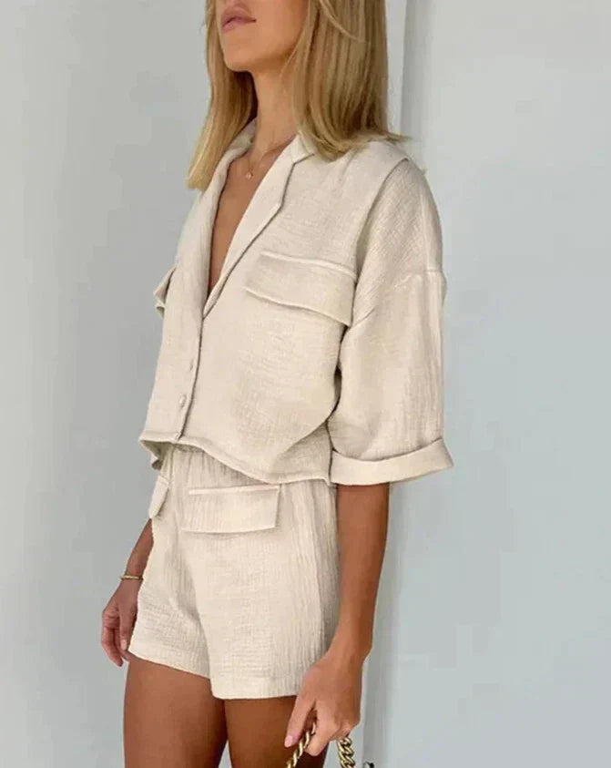 Chic women's matching short set with a stylish button-down top and high-waisted shorts. Great for casual summer wear.