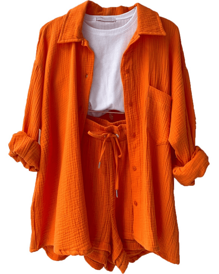 Casual women's fashion two-piece outfit with a loose-fitting shirt and matching trousers