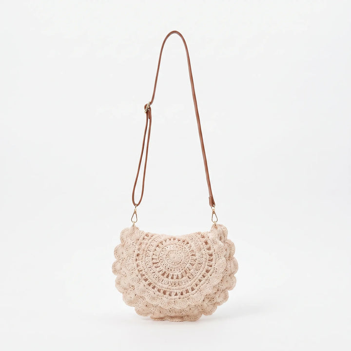 Chic woven saddle bag for women with a decorative scalloped flap. A versatile casual shoulder or crossbody bag.
