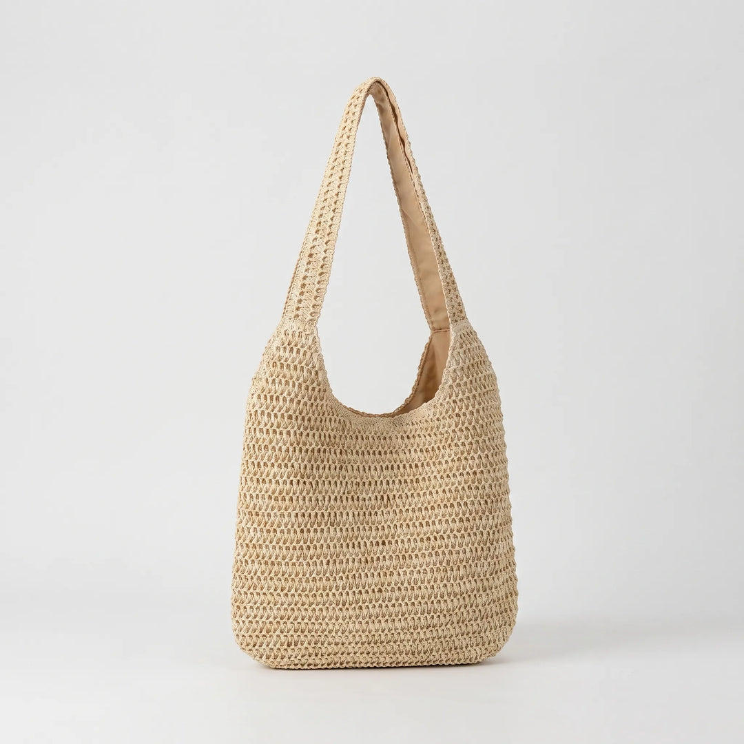 Stylish women's woven beach tote bag, ideal for summer getaways and carrying essentials.