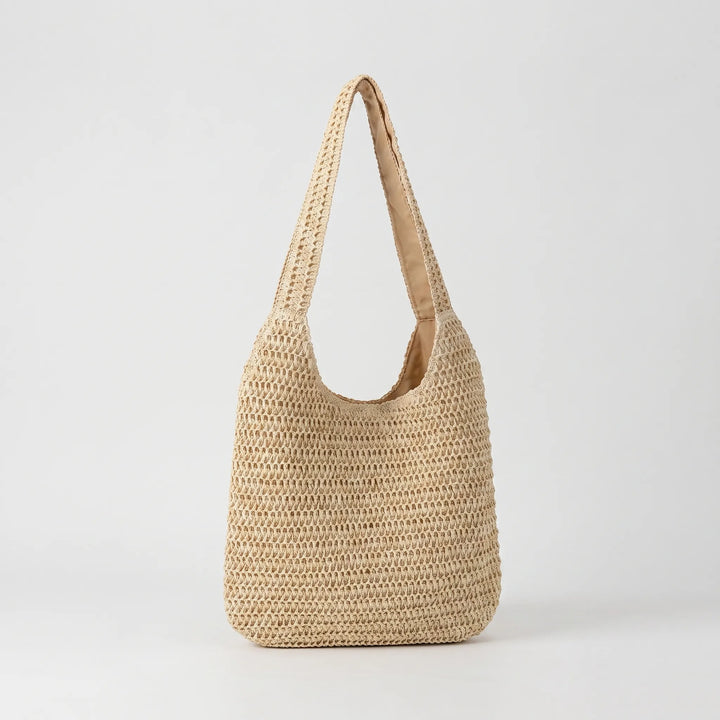 Stylish women's woven beach tote bag, ideal for summer getaways and carrying essentials.