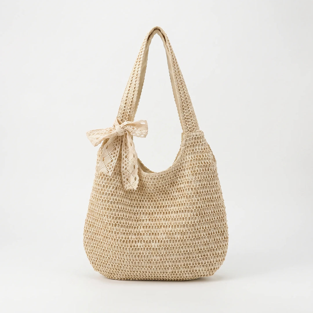 Chic women's casual woven tote bag with a spacious open top, perfect for the beach or summer style.
