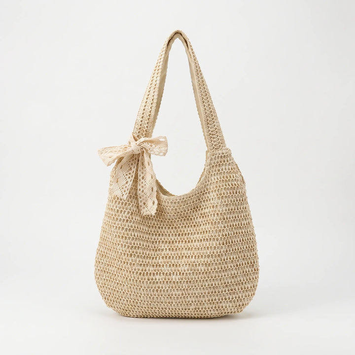 Chic women's casual woven tote bag with a spacious open top, perfect for the beach or summer style.