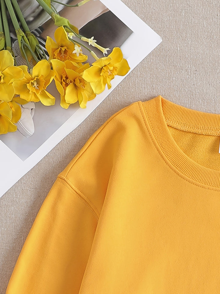 Playful yellow women's sweatshirt, long-sleeve, round-neck, with a funny graphic print. Ideal casual fall wear.