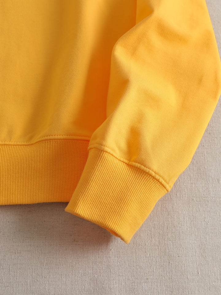 Stylish yellow women's sweatshirt. Casual long-sleeve top with a humorous graphic print for everyday comfort & fall.