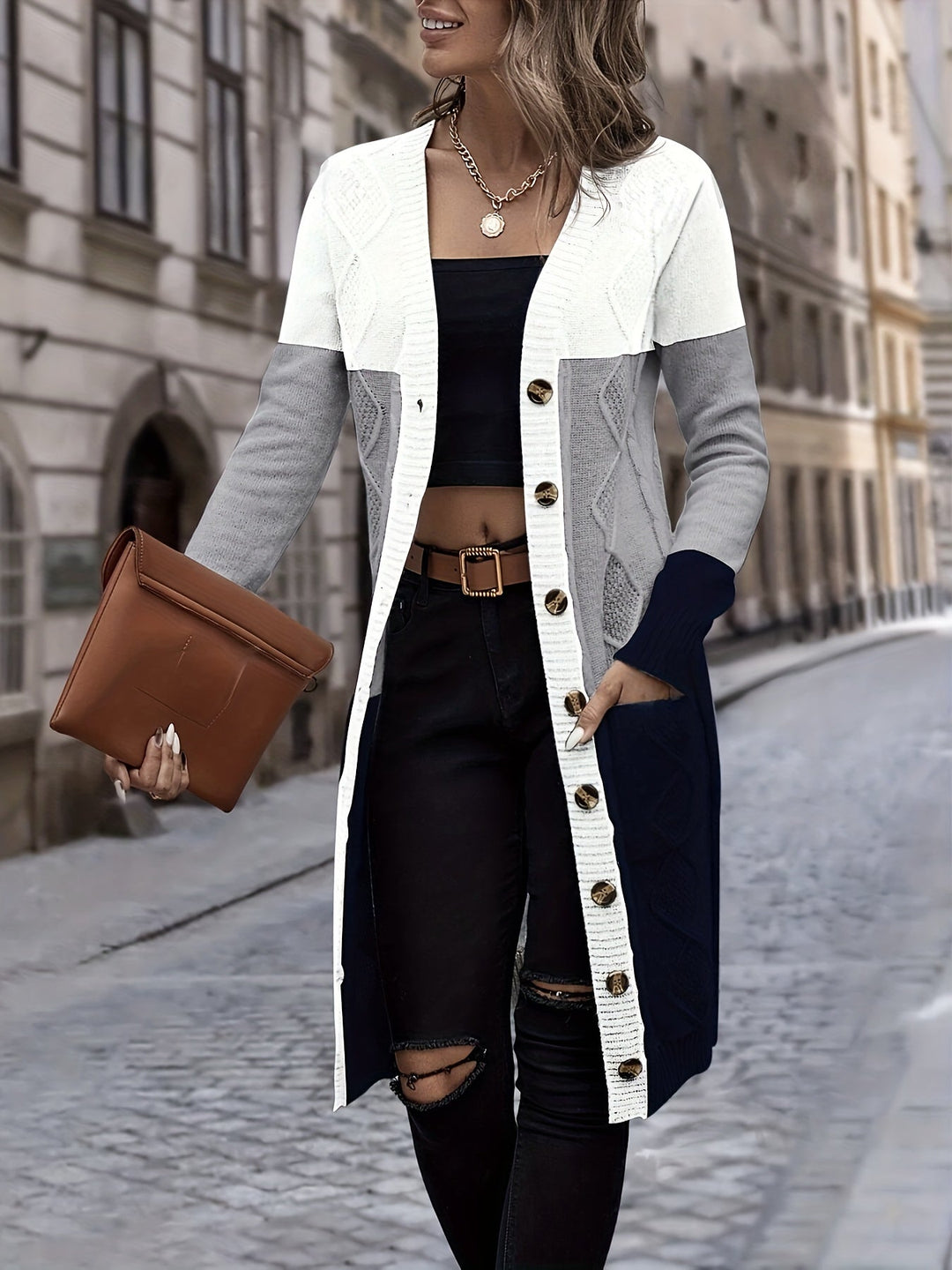 Chic women's long sleeve cardigan vest in Celeste blue. Versatile acrylic outerwear for casual fashion.