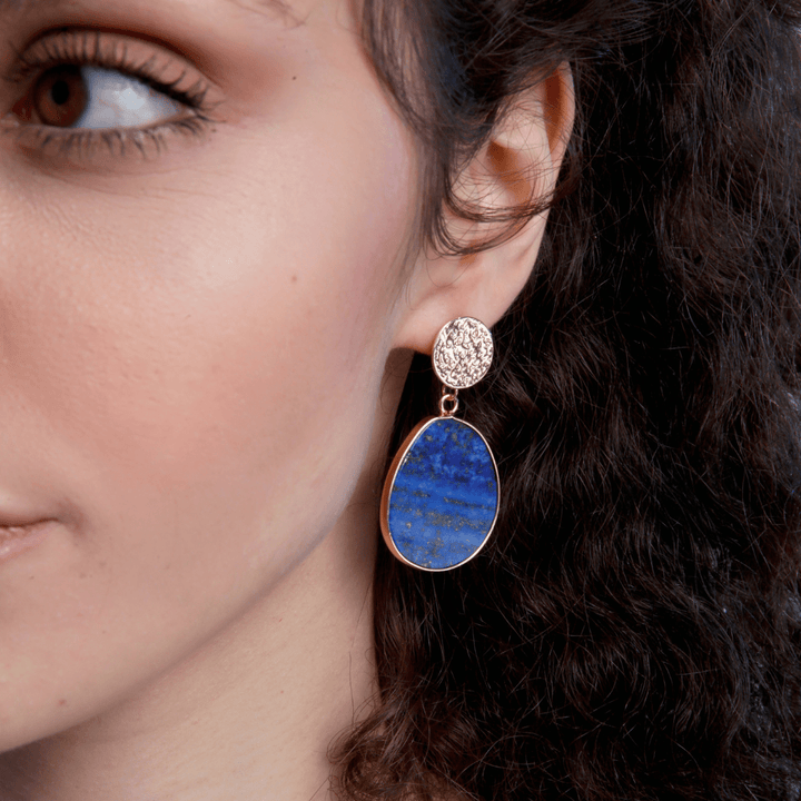 Handmade women's celestial drop earrings featuring vibrant blue lapis lazuli gemstones.