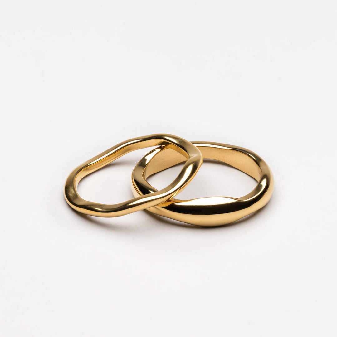 Women's celestial stackable ring set, gold & silver bands. Fashionable, hypoallergenic, water-resistant jewelry.