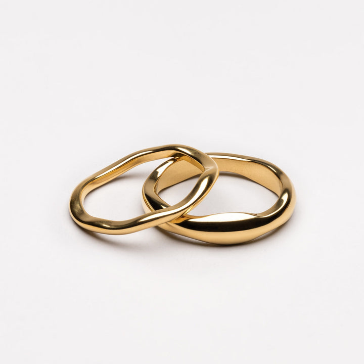 Women's celestial stackable ring set, gold & silver bands. Fashionable, hypoallergenic, water-resistant jewelry.