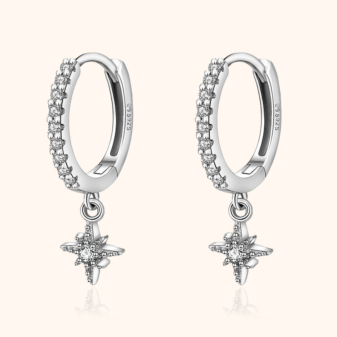 Women's celestial star hoop earrings, elegant gold plated fashion jewelry with sparkling zirconia accents.